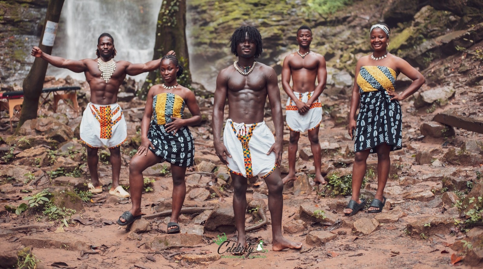 A group of professional massage therapists standing together in a spa setting, smiling and wearing uniforms